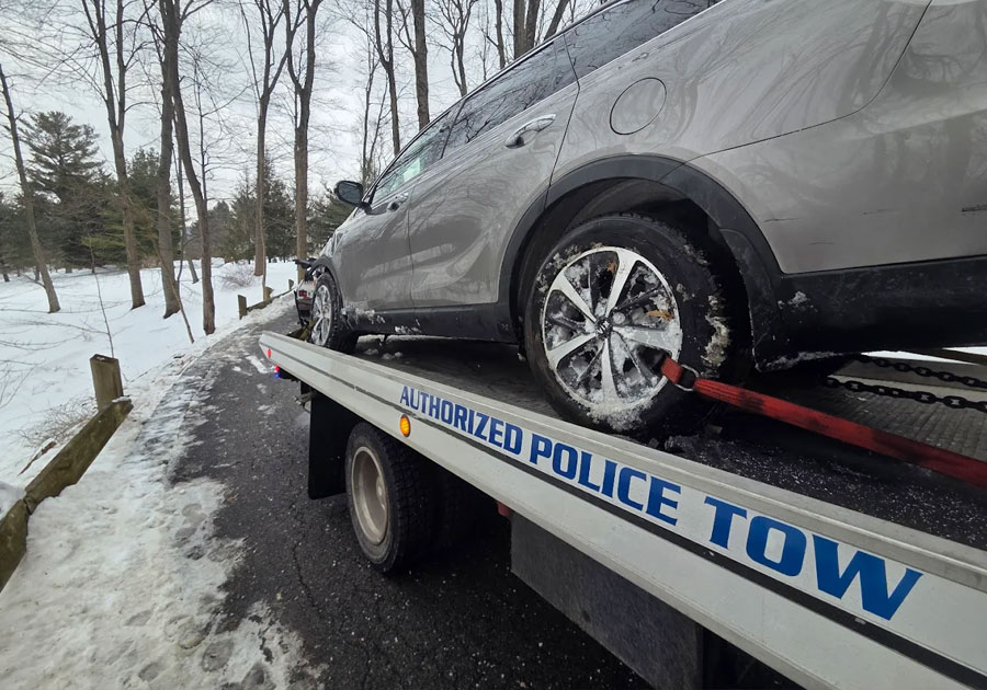 Authorized Police Towing Service Chappaqua New York Castle Auto and Towing Car on Flatbed Tow Truck