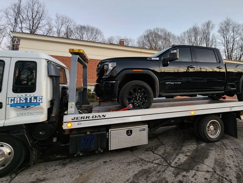 Castle Auto and Towing Chappaqua New York Flatbed Tow Truck Towing Black Truck