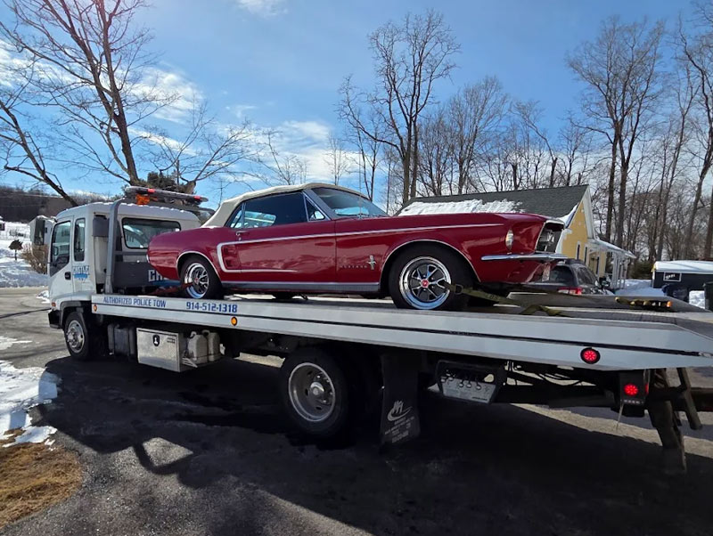 Castle Auto and Towing Chappaqua New York Flatbed Tow Truck Towing Classic Car Red Mustang