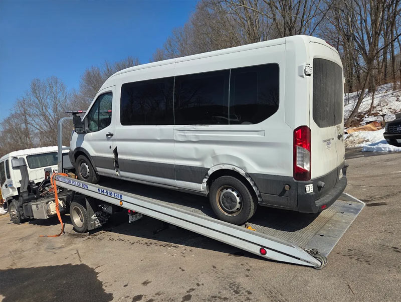 Castle-Auto-and-Towing-Chappaqua-New-York-Flatbed-Tow-Truck-loading-Van Castle Auto And Towing Chappaqua New York Flatbed Tow Truck Towing White Van