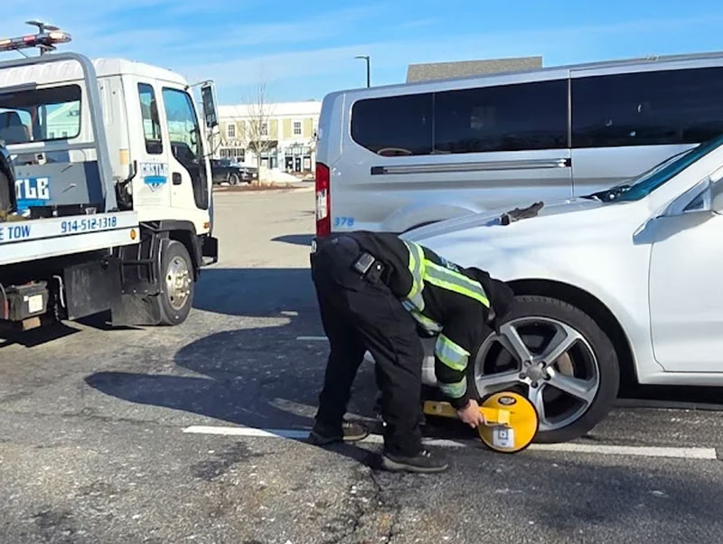 Castle Auto and Towing Chappaqua New York Tow Truck Operator Booting Car 