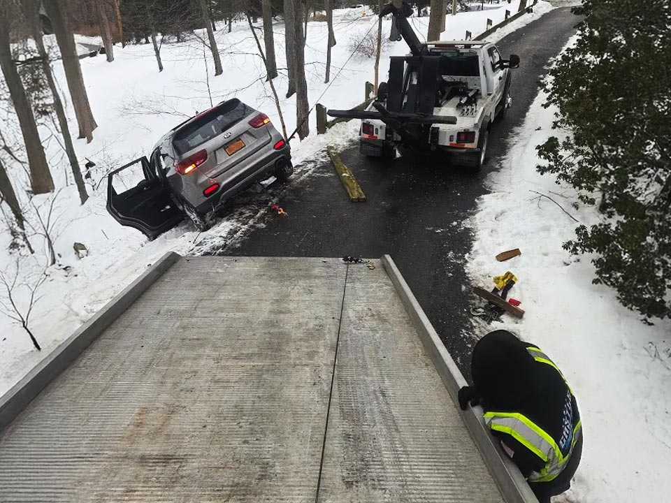 Roadside Assistance Chappaqua New York Castle Auto and Towing Winching a stuck car out of snow