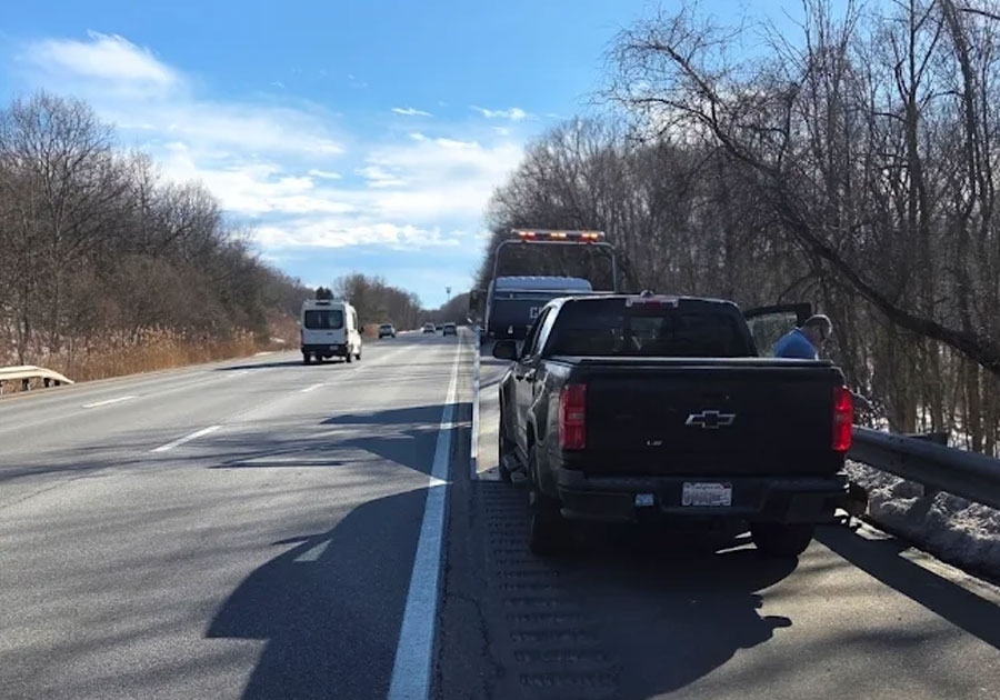 Towing Service Castle Auto and Towing Chappaqua New York Loading A truck on the highway