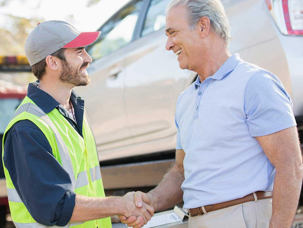 Tow Truck Service Mount Kisco New York Tow Truck Operator smiling at motorist